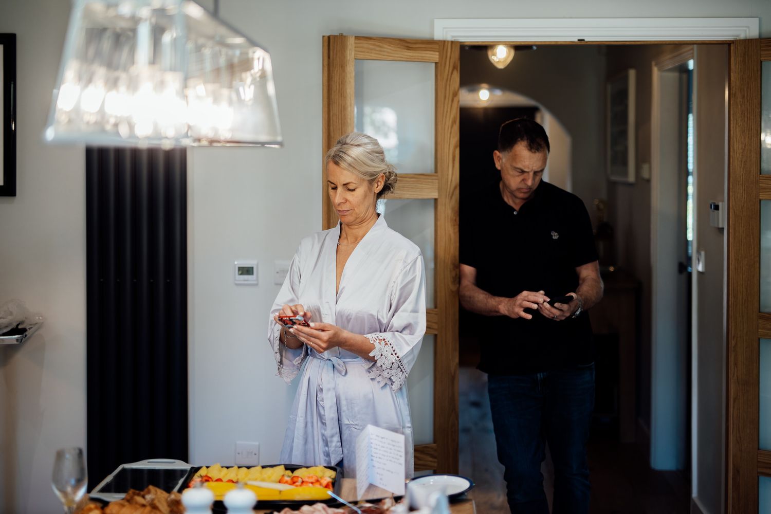 Documentary style black and white photos of wedding morning preparations.