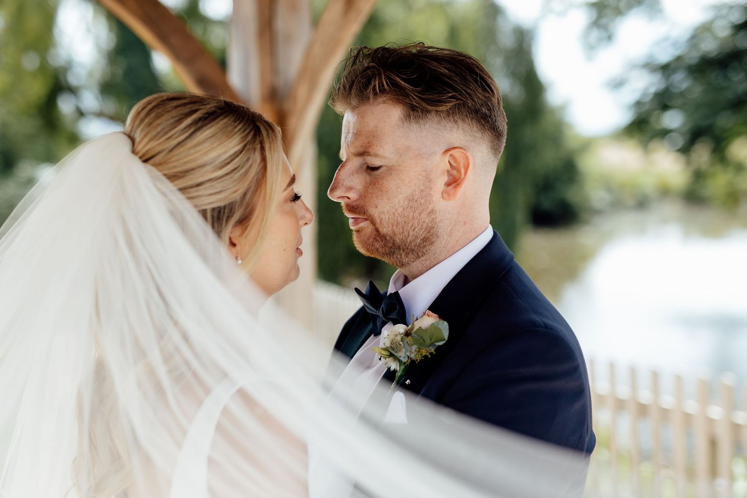 Romantic wedding couple moments captured in natural outdoor lighting.