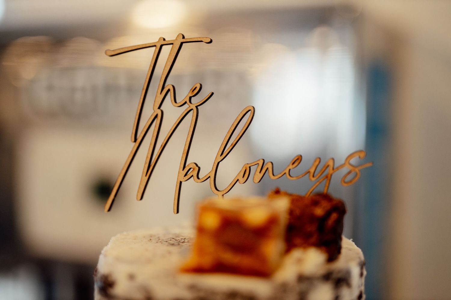 Decorative gold script signage displayed at wedding reception.