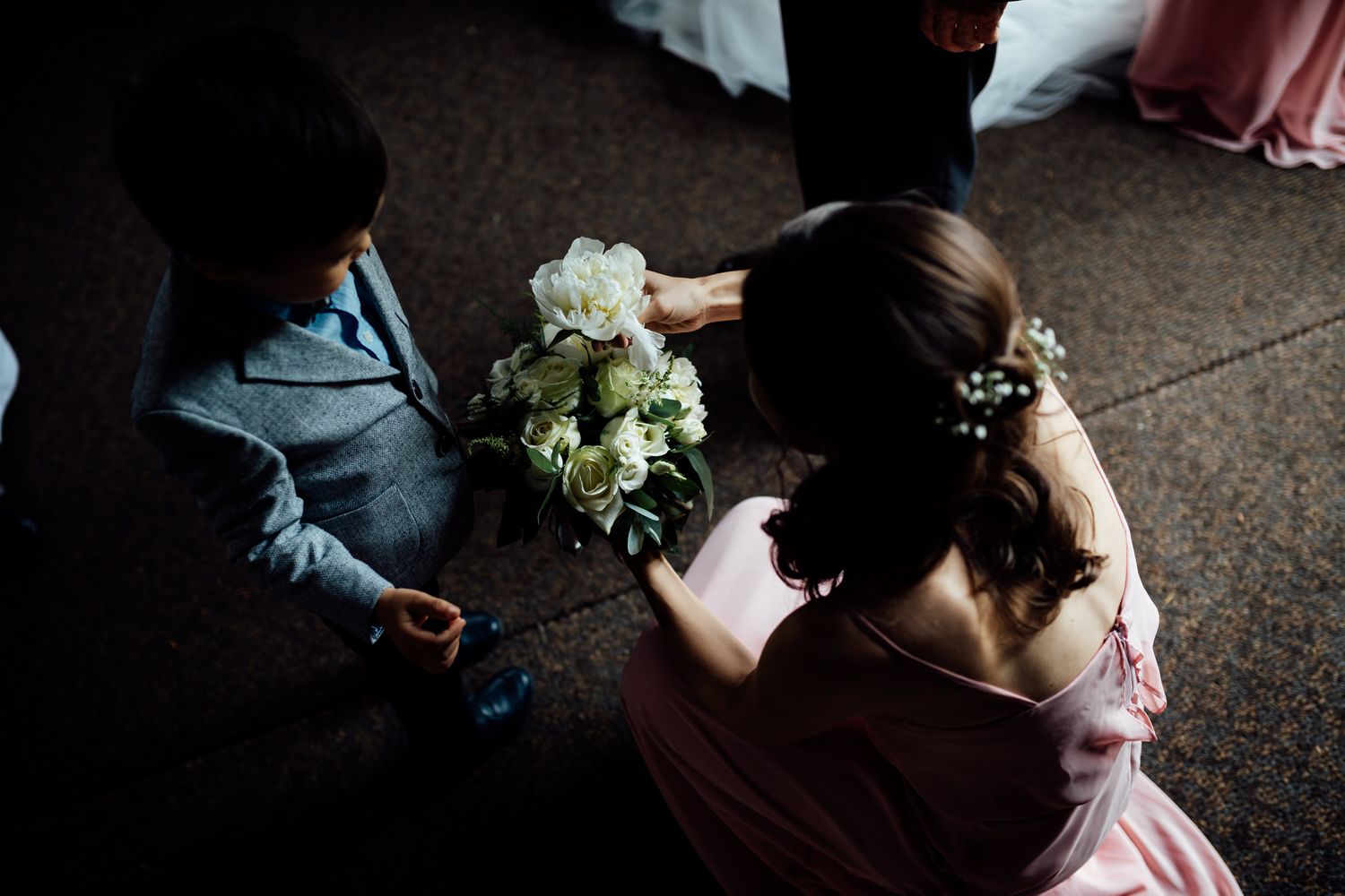 Elegant wedding ceremony setup inside a historic stone church with natural light streaming in.