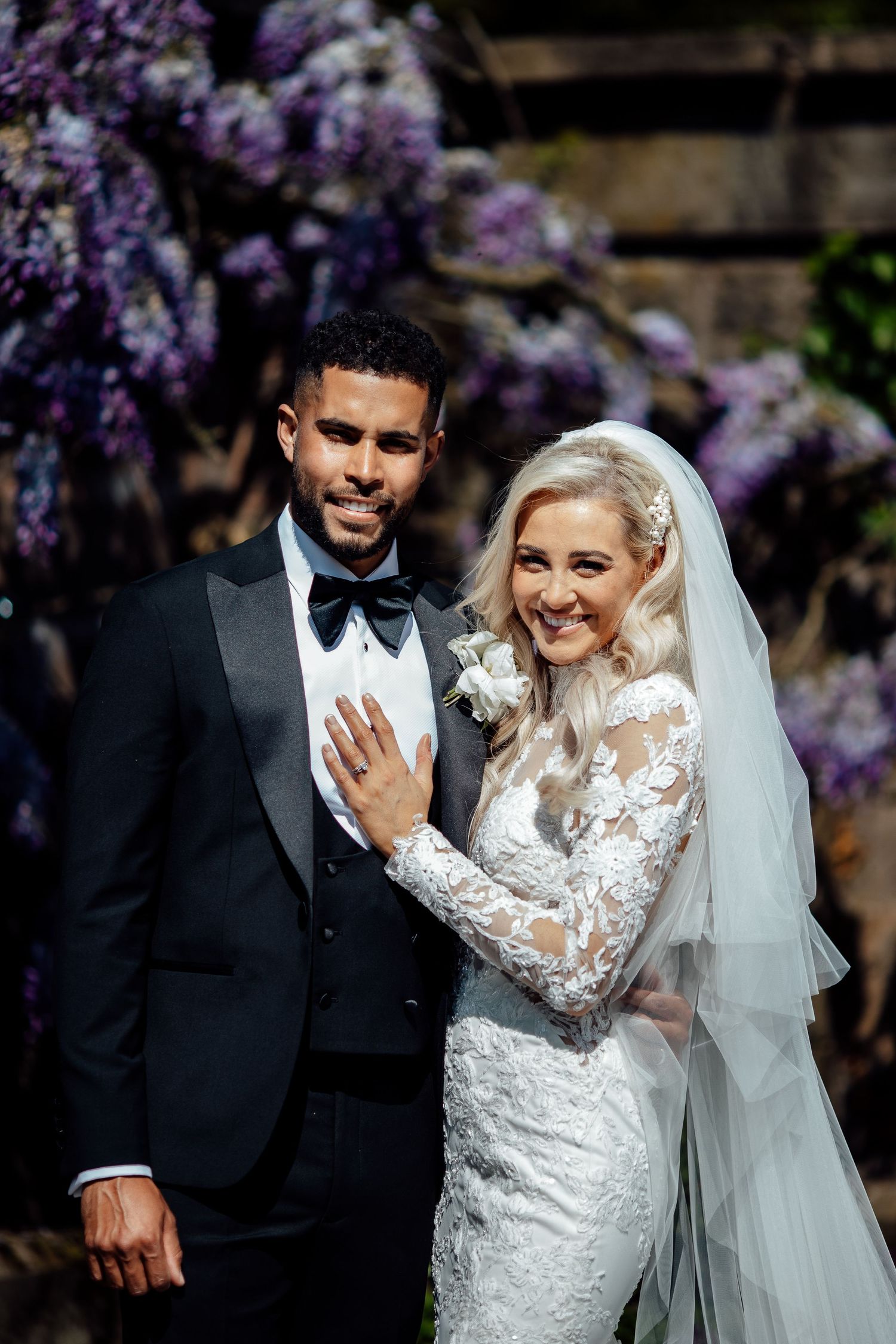 Couple sharing a joyful moment during their outdoor wedding ceremony.