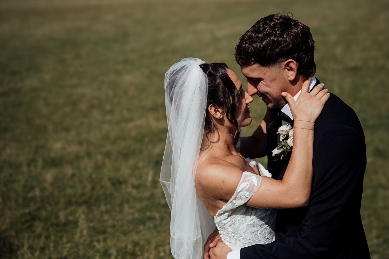 Romantic wedding portraits captured in natural outdoor setting.