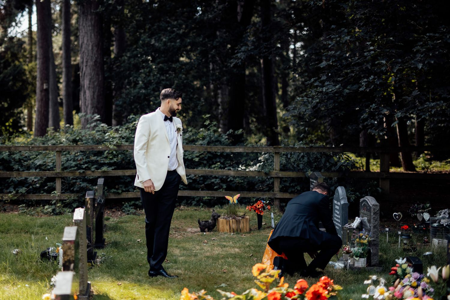 Outdoor wedding celebration in wooded setting with natural decor and autumn colors.
