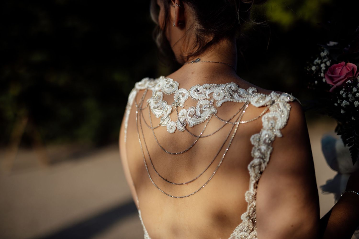 Close-up detail shots of delicate bridal jewelry and lace embellishments on a wedding dress.