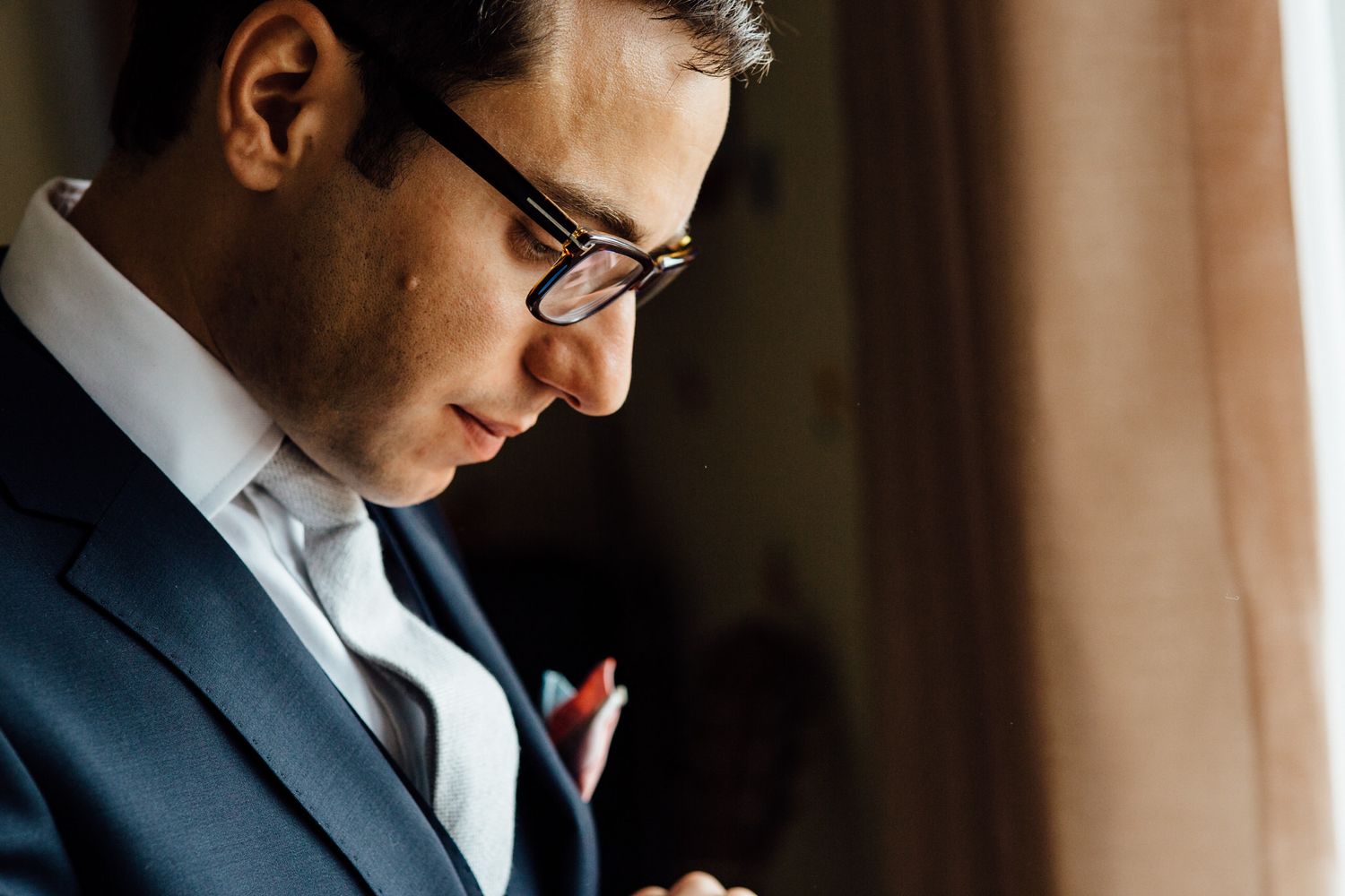 Classic formal wear and preparations in warm interior lighting.