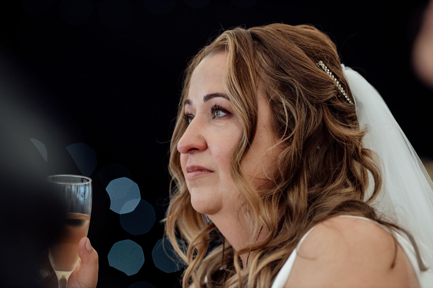 Candid moments captured during an evening wedding reception.