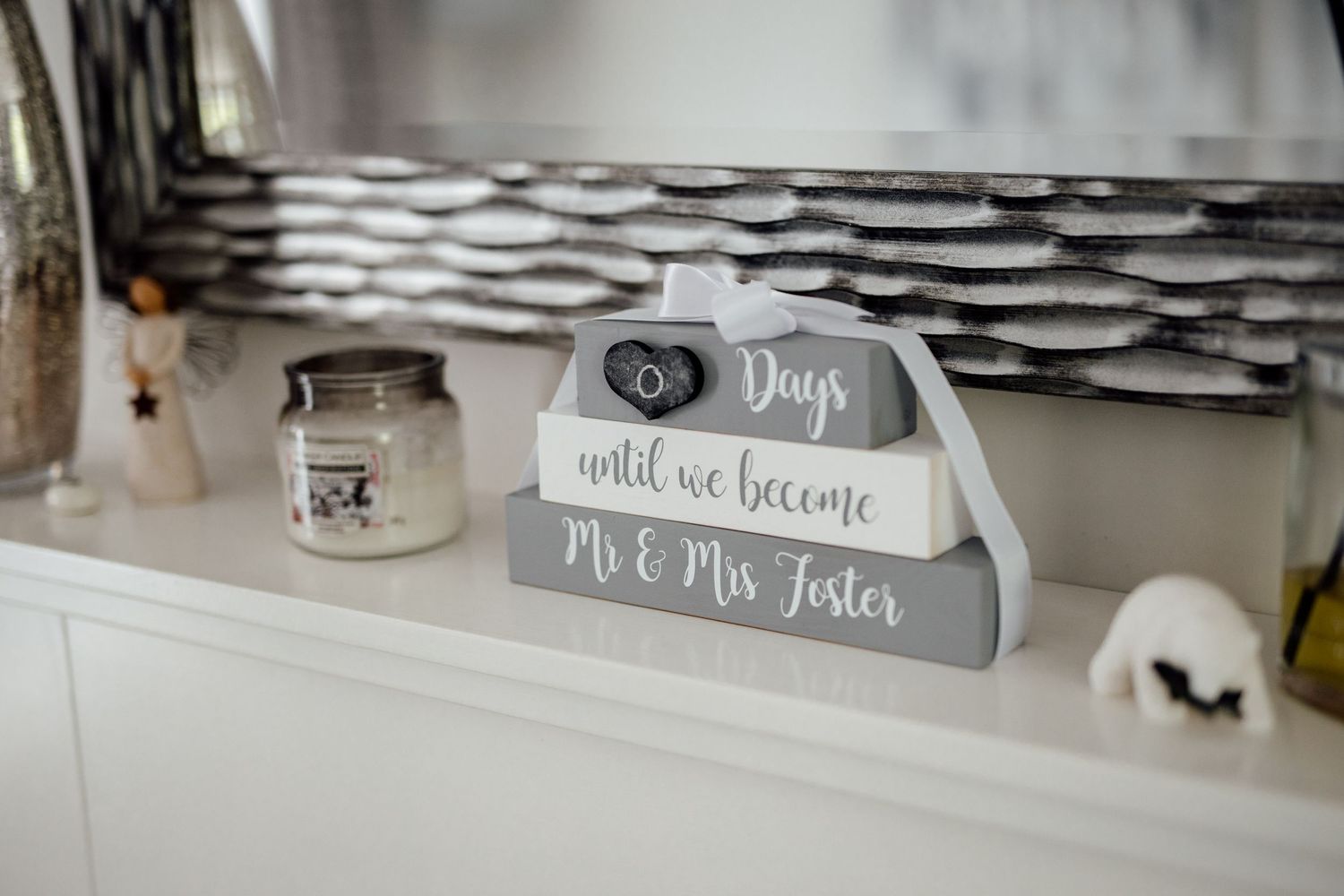 Wedding reception detail showing rustic chalkboard signs and table decor.
