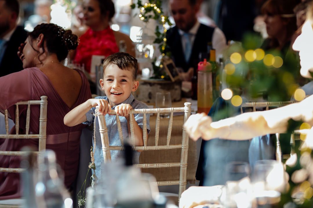 Candid reactions of wedding guests during reception speeches and toasts.