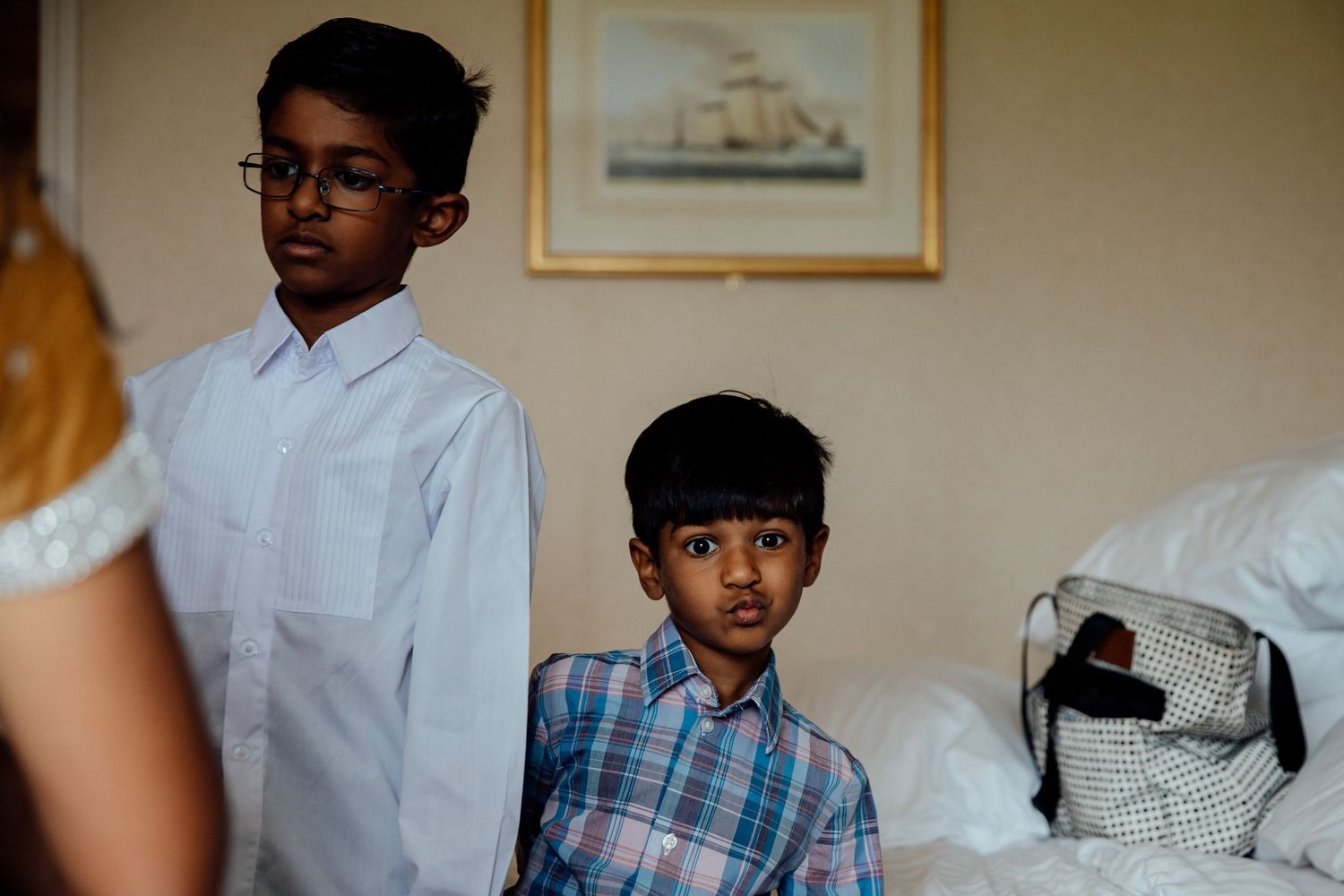 Wedding guests gather in a room wearing formal attire for a special celebration.