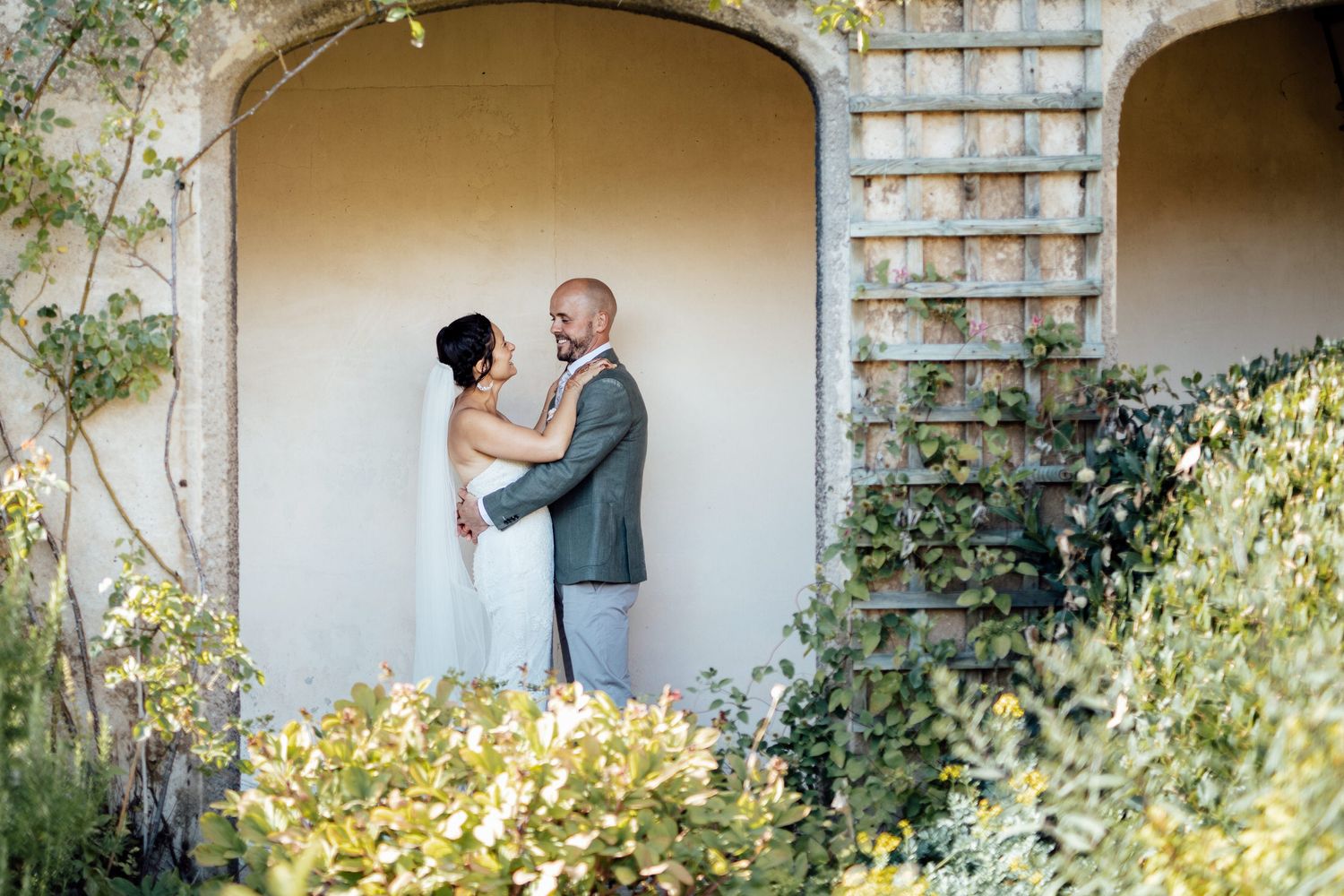 A series of elegant arched walkways with climbing vines and natural light.