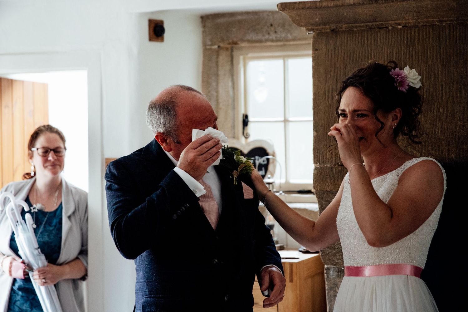Interior shots of wedding preparations in a rustic room with natural window light.