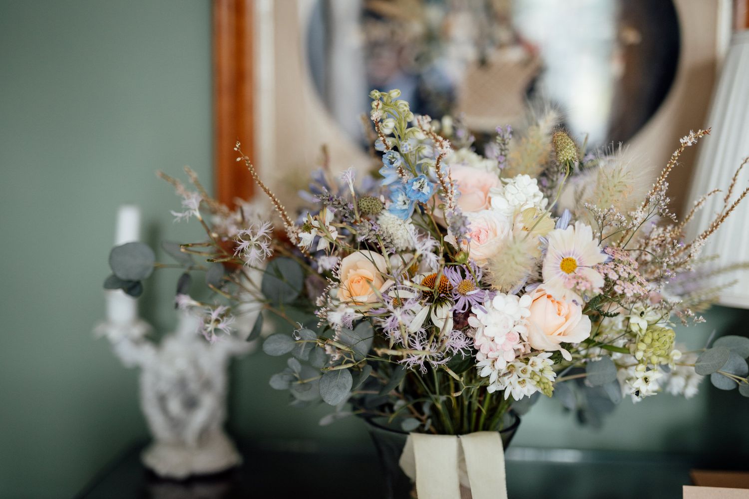 Delicate floral arrangements with white and peach blooms on display.