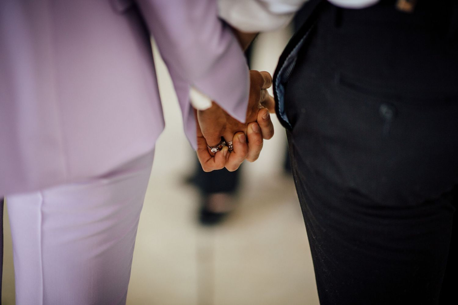 Detail shots of formal attire in soft purple and black tones.