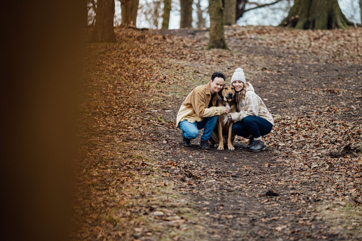 Natural winter engagement photos taken in a peaceful wooded setting.
