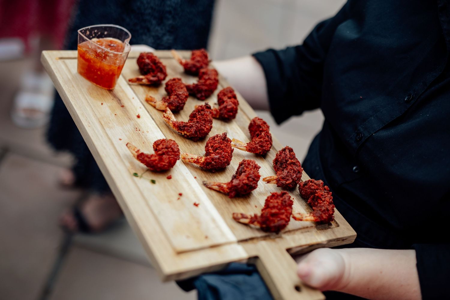 Wooden boards displaying artfully arranged bruschetta appetizers at an upscale event.