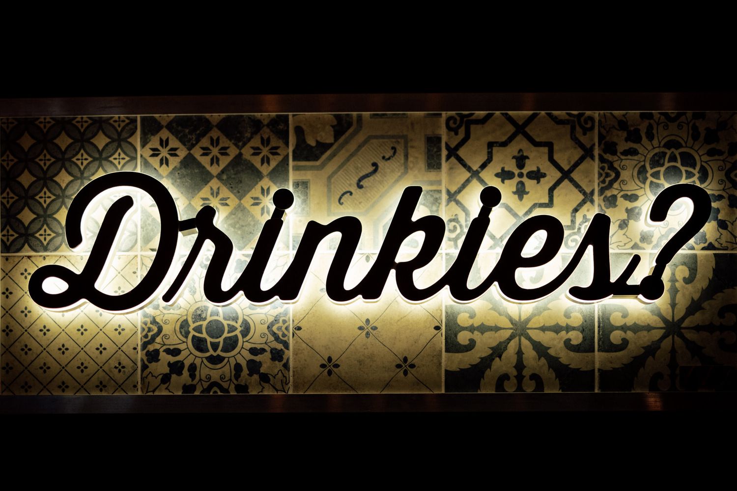 Vintage style decorative text banner with ornate gold patterns.