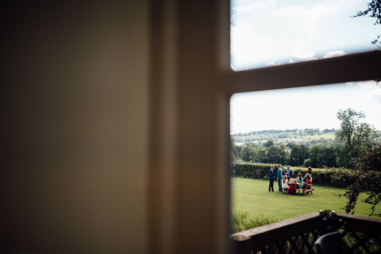 Scenic countryside view from a wedding venue overlooking rolling hills.