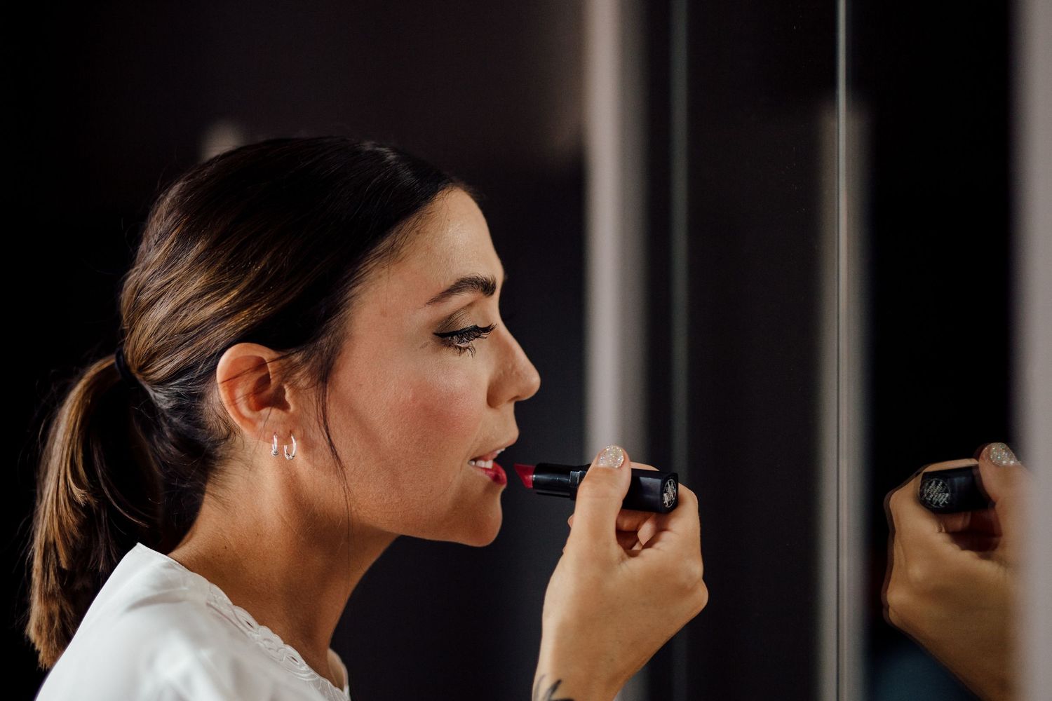 Close-up beauty shots showing makeup application and profile views.