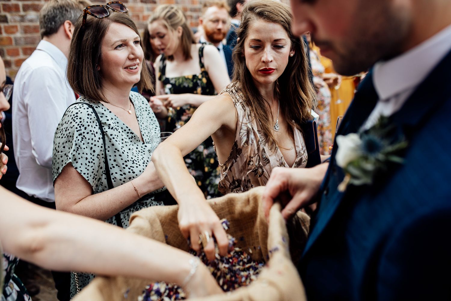 Wedding guests dancing and enjoying themselves at a lively reception.