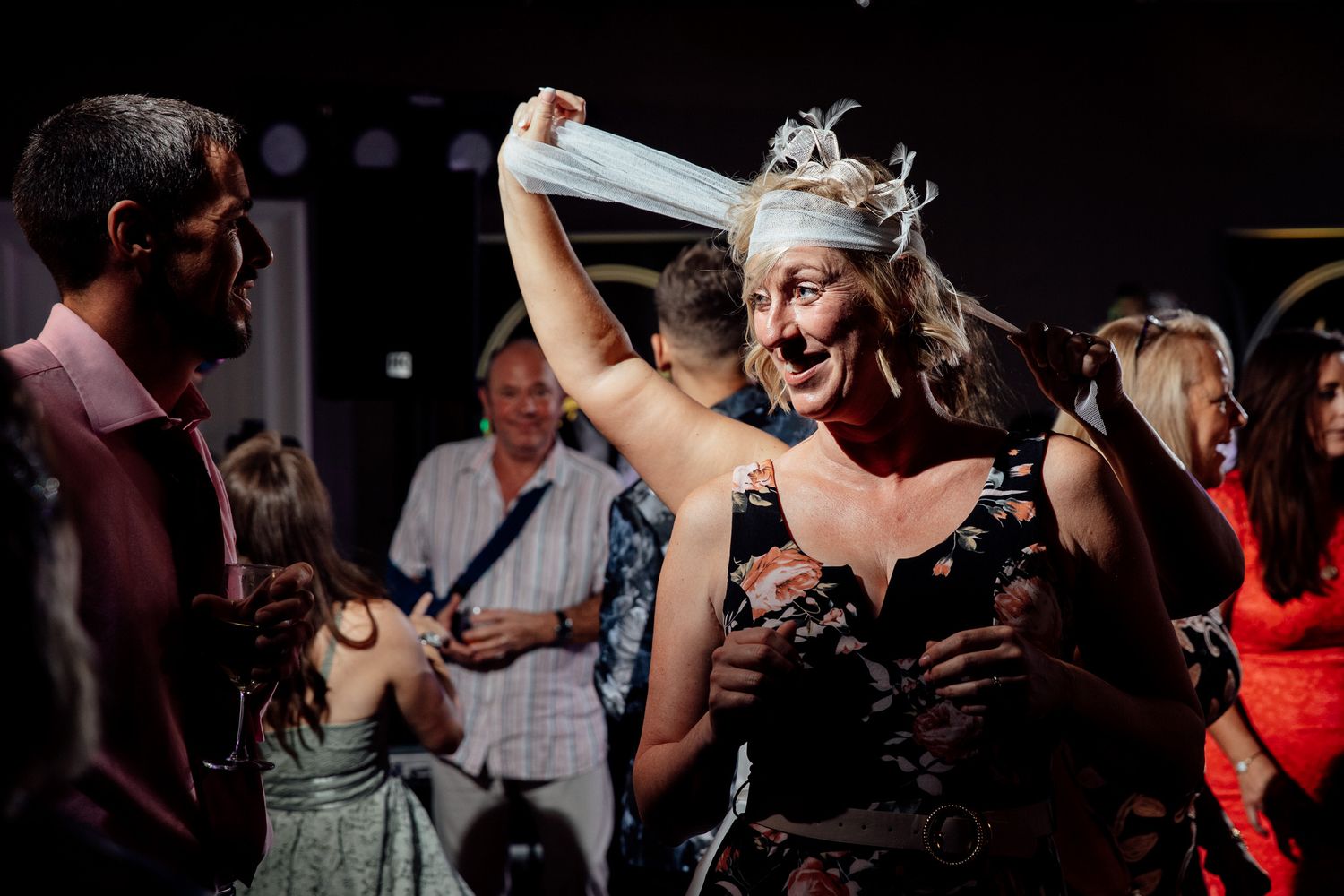 Energetic dance party scene with celebratory atmosphere and festive lighting.