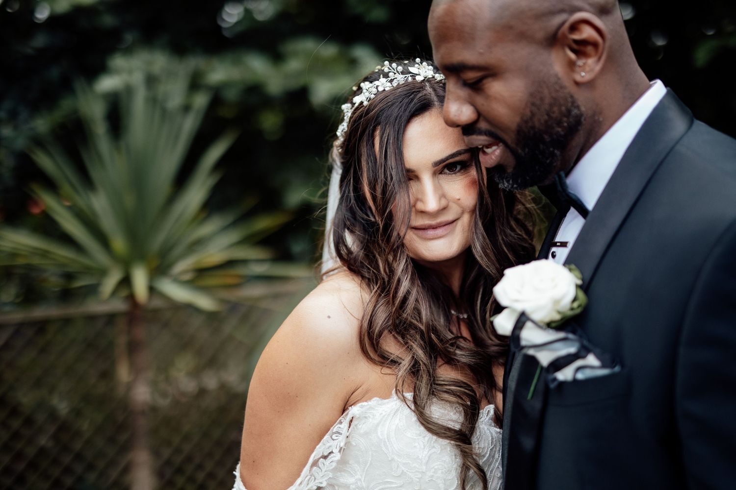 Intimate wedding portrait moments captured in a garden setting.