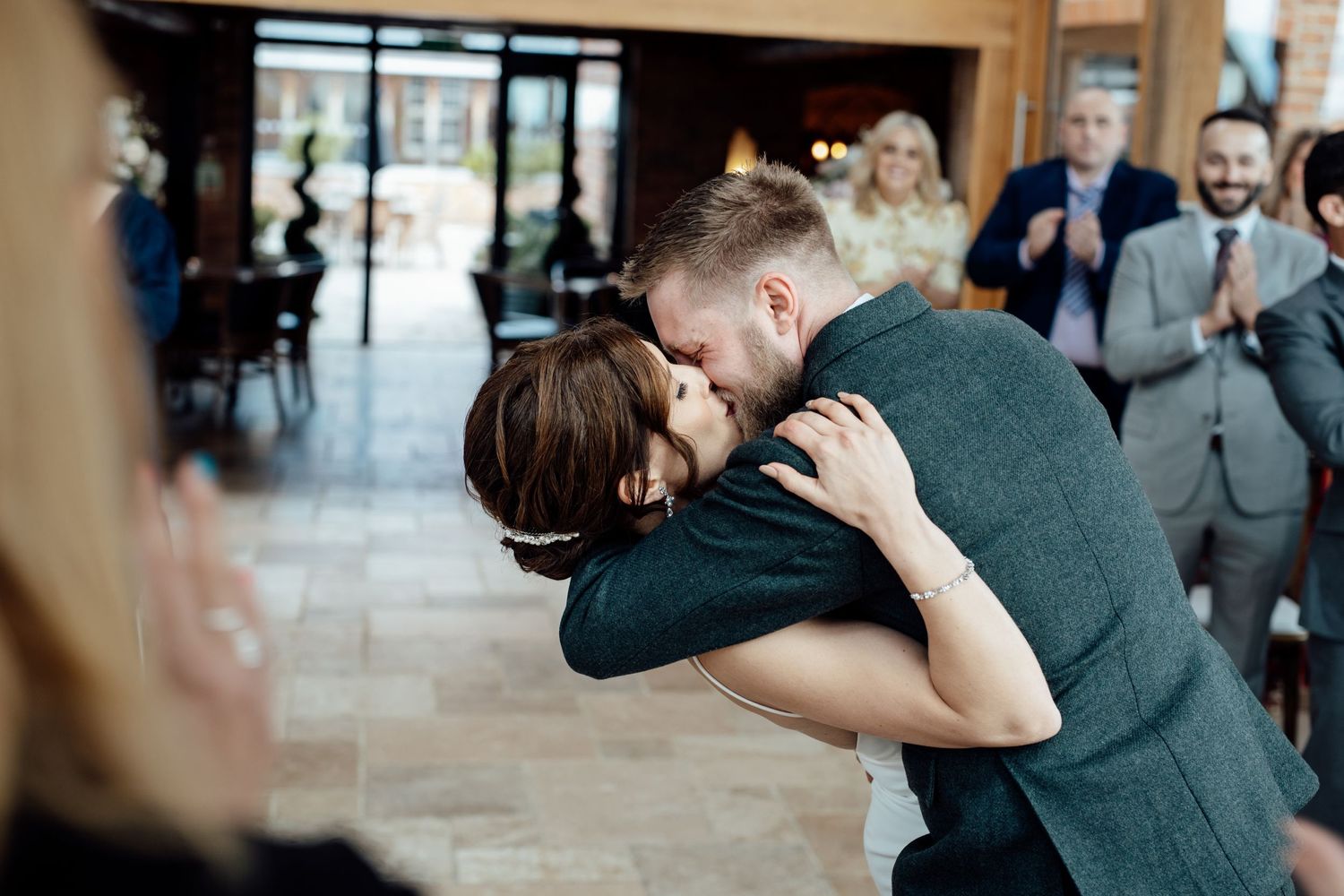 Romantic first dance moment at an indoor wedding reception.