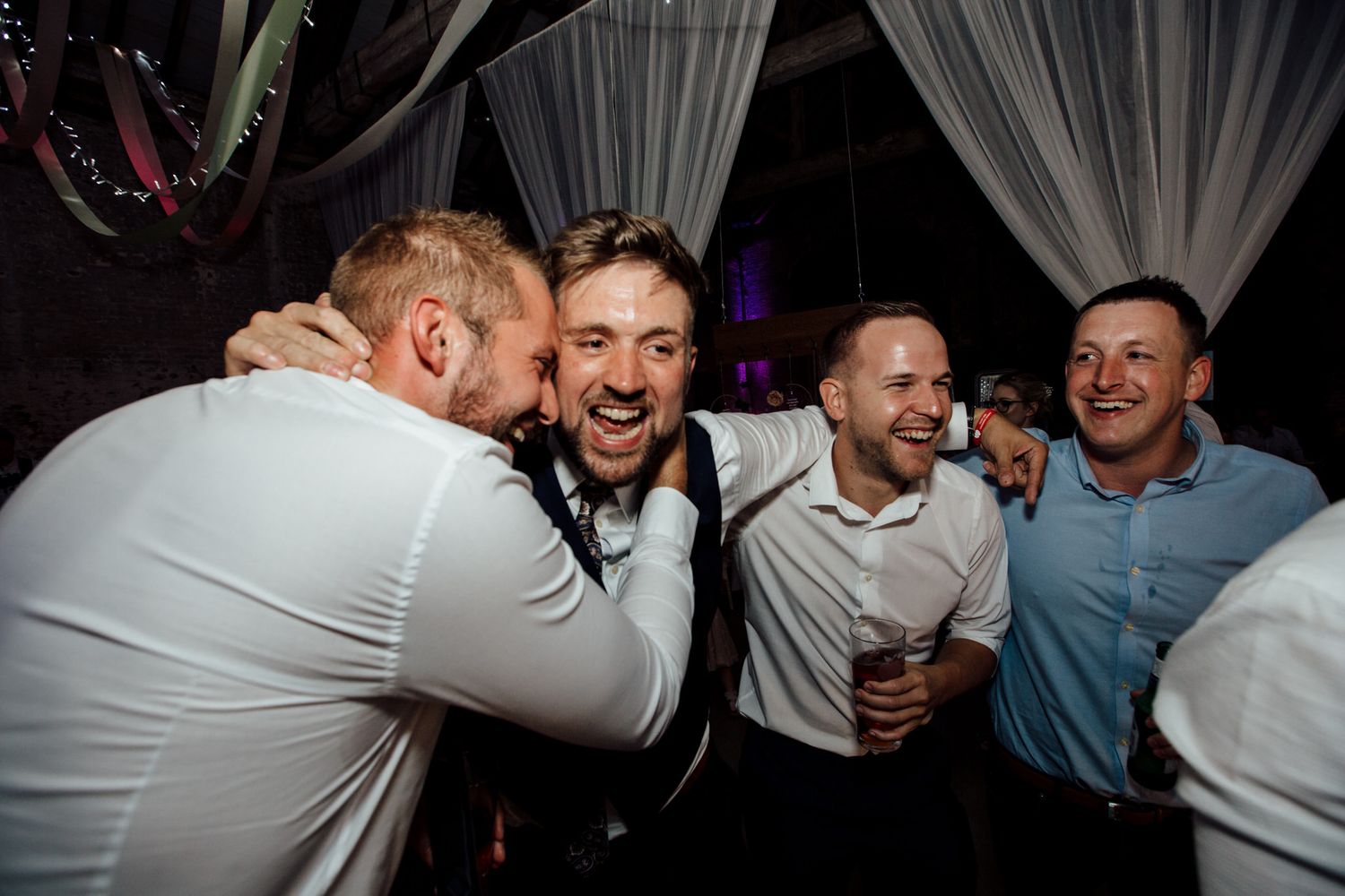 Joyful celebration scene at an evening reception party.