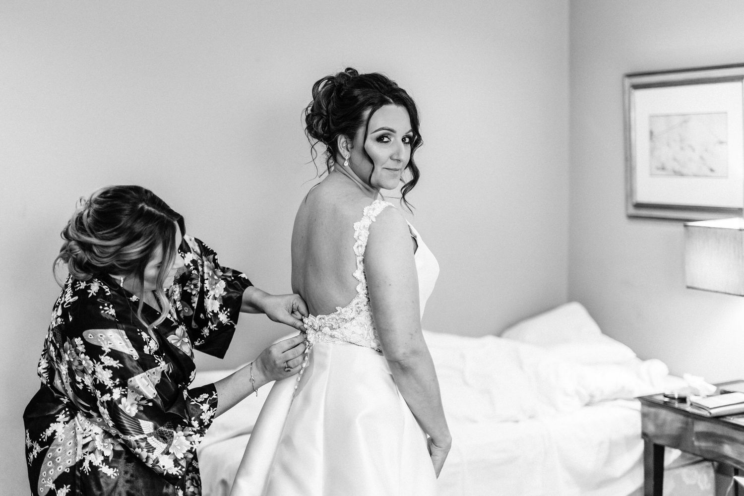 Wedding party preparations in a bright, sunlit room with elegant decor.