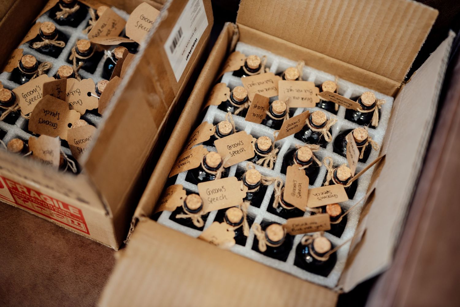 Wedding favors and gift boxes arranged in neat rows at reception.