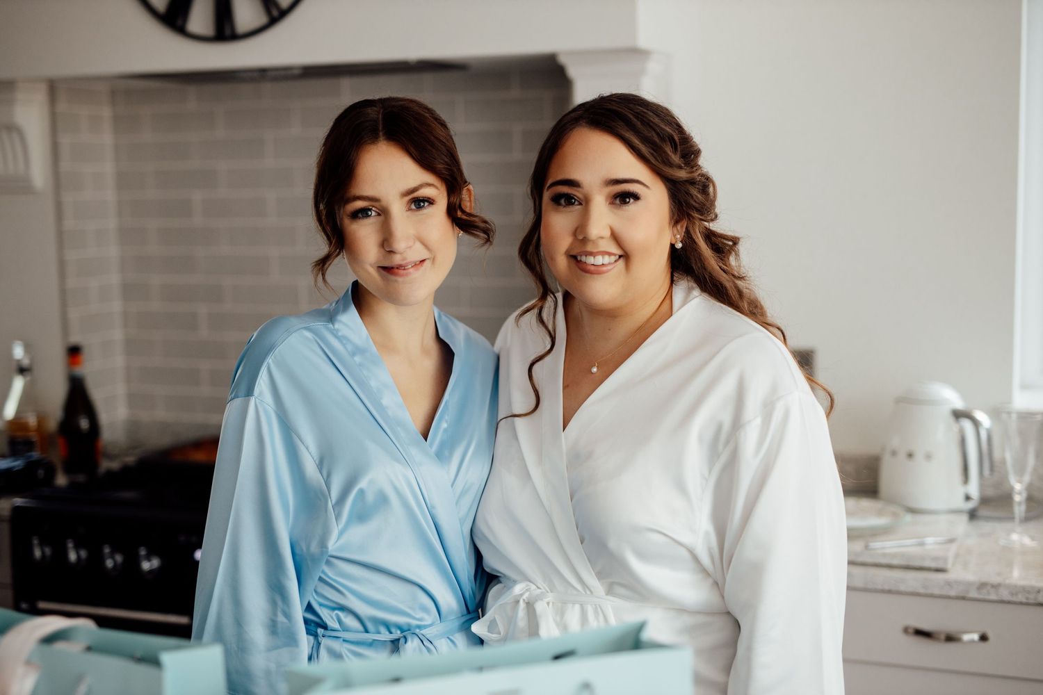 Wedding morning preparations in bright modern kitchen setting.