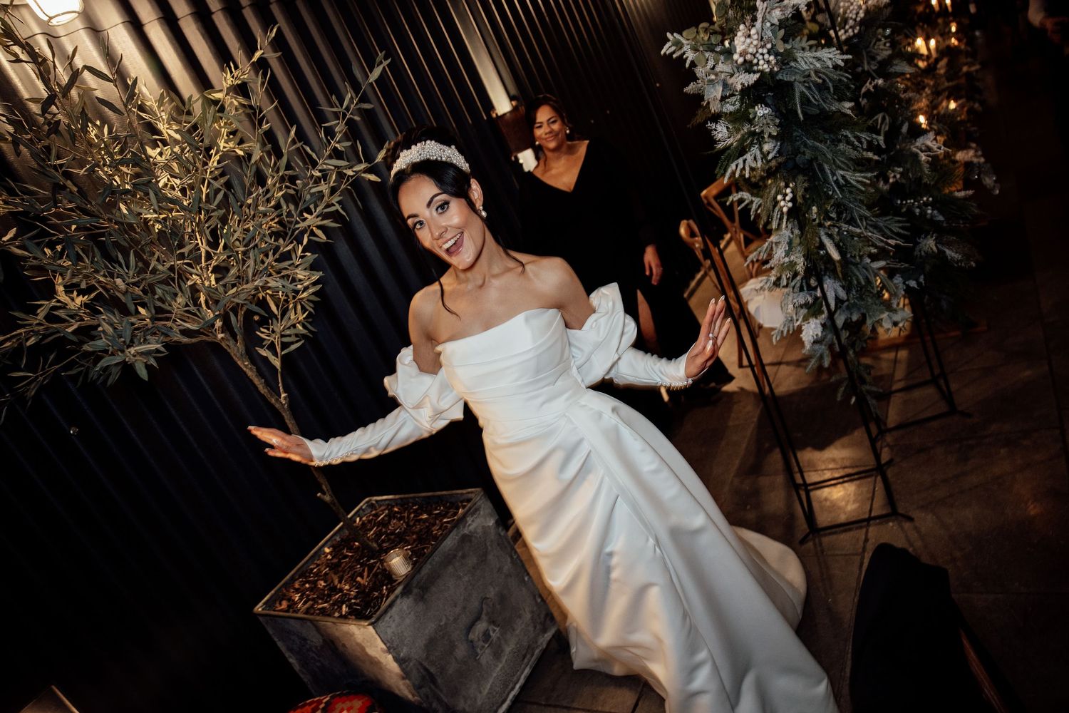 Wedding celebration at night with string lights creating a magical dance floor atmosphere.