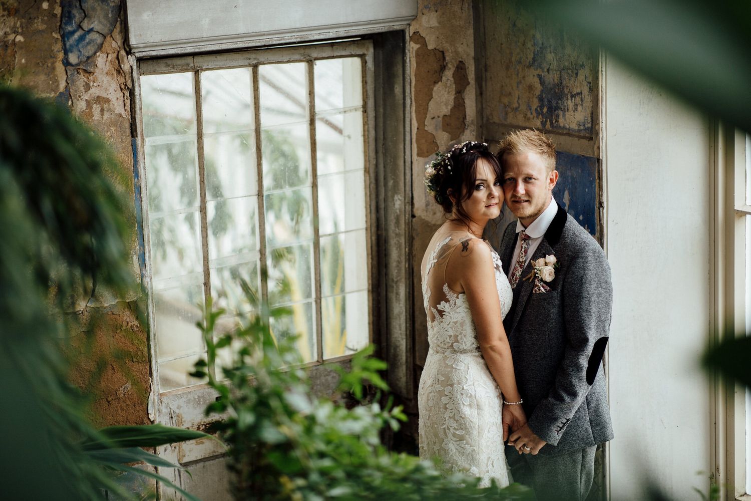 Intimate wedding moments captured in a sunlit conservatory setting.