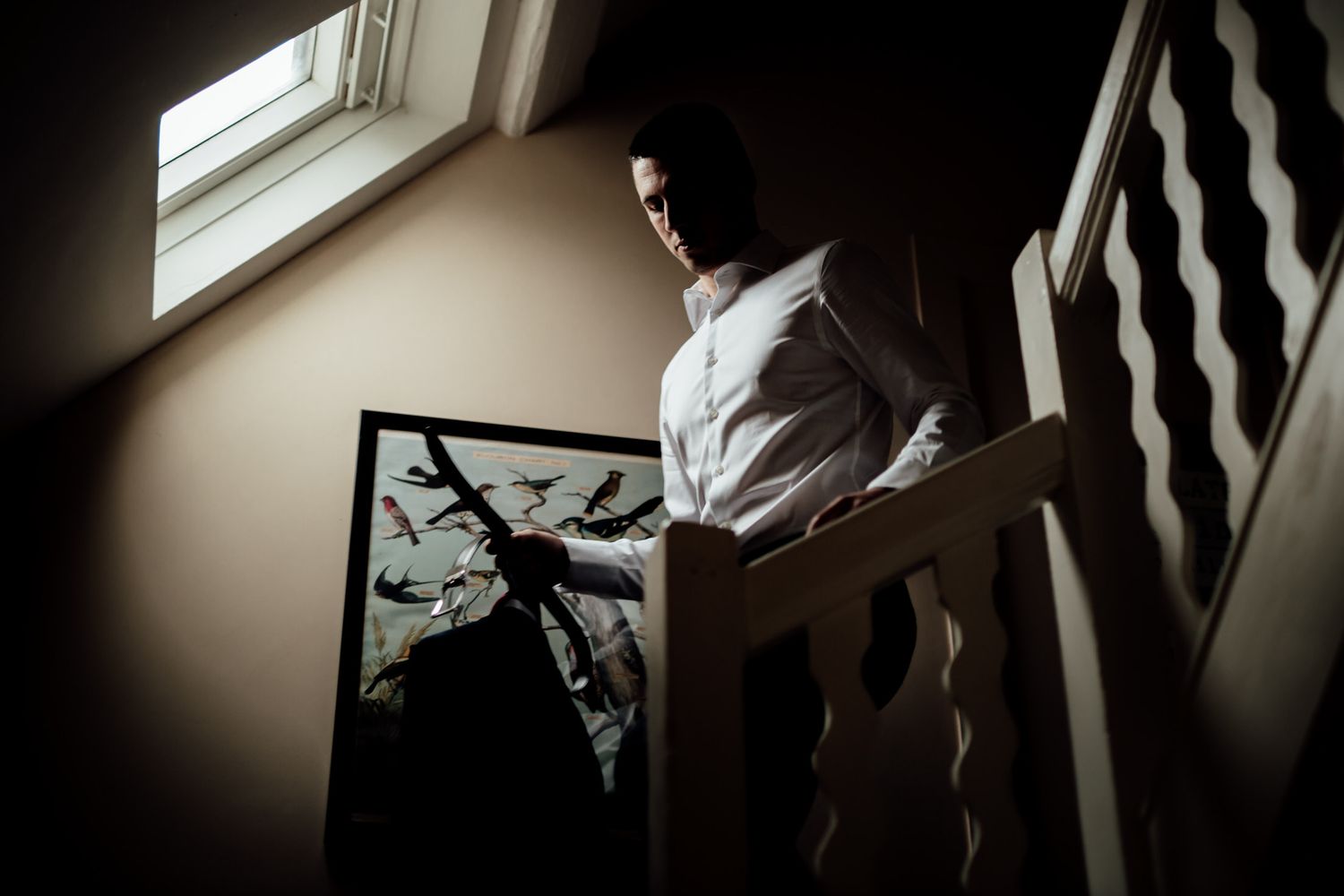Dramatic black and white staircase shots during wedding preparation.
