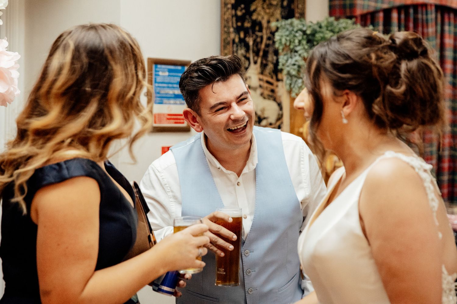 Casual reception moments with guests mingling and celebrating at the wedding party.