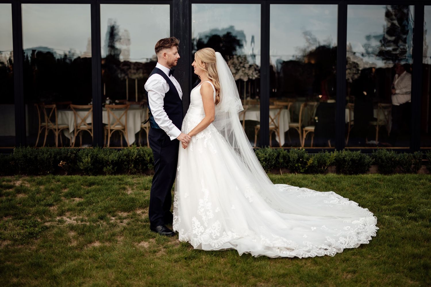 Romantic outdoor wedding portraits in natural garden setting.