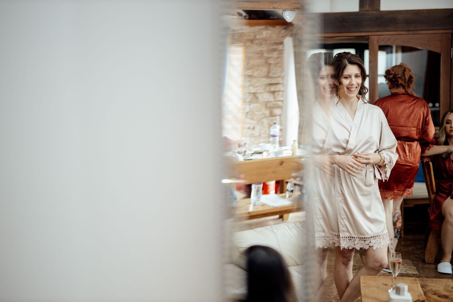 Candid moments captured during wedding reception in rustic brick venue.