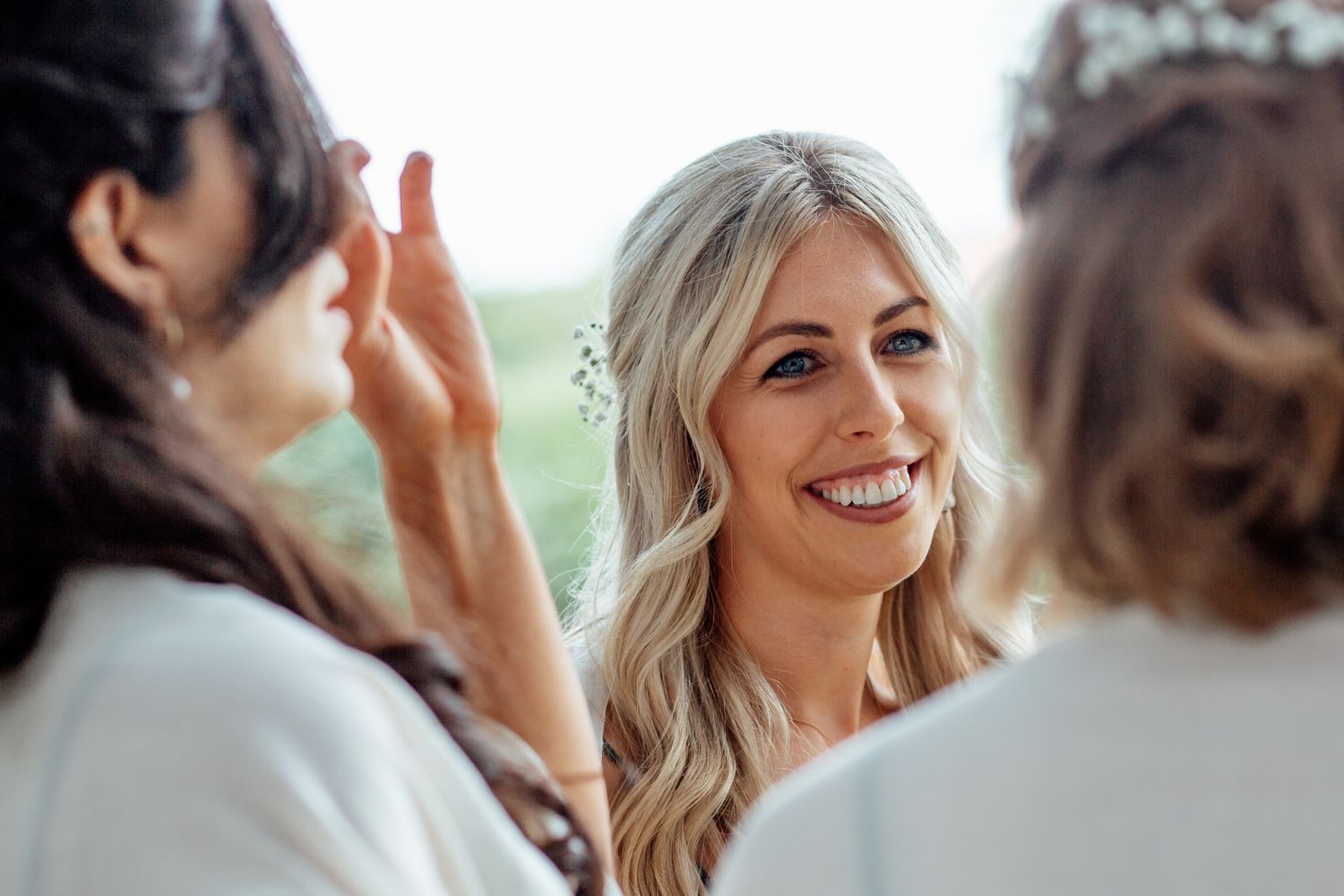 Joyful candid moments shared between wedding attendees.