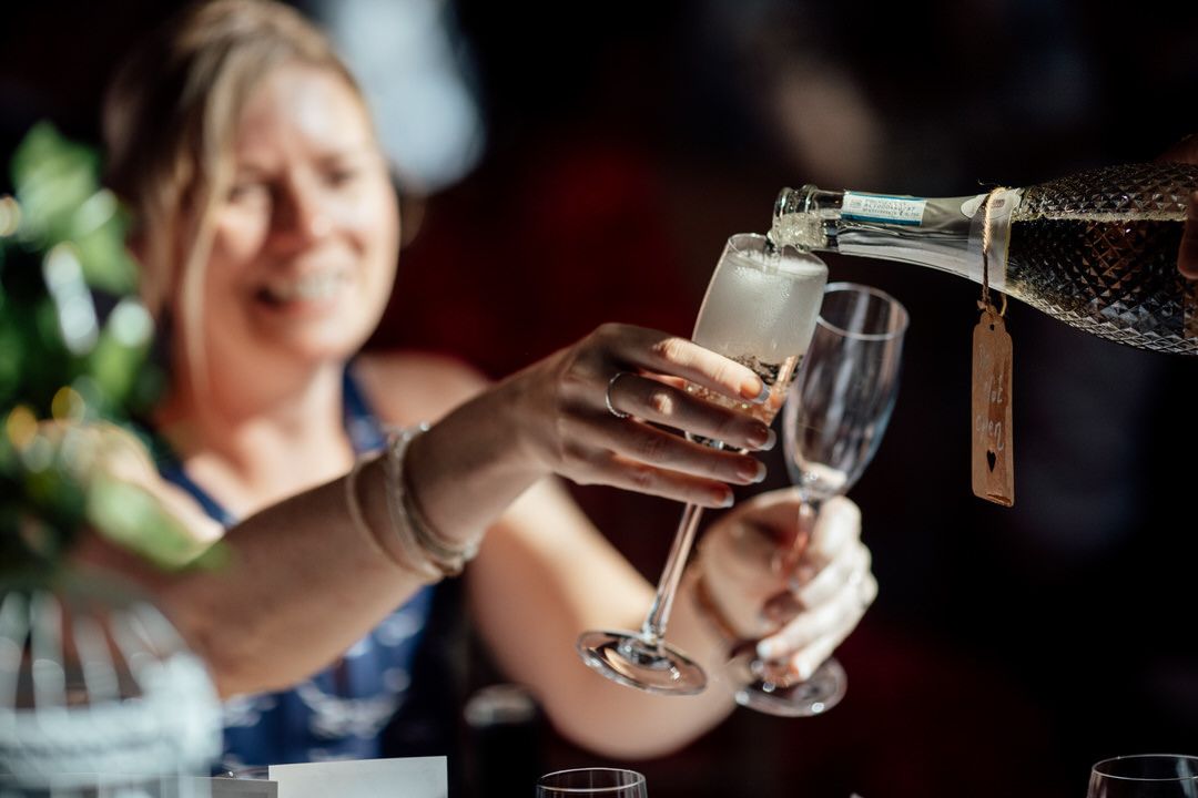Candid moments of guests enjoying wedding reception entertainment.