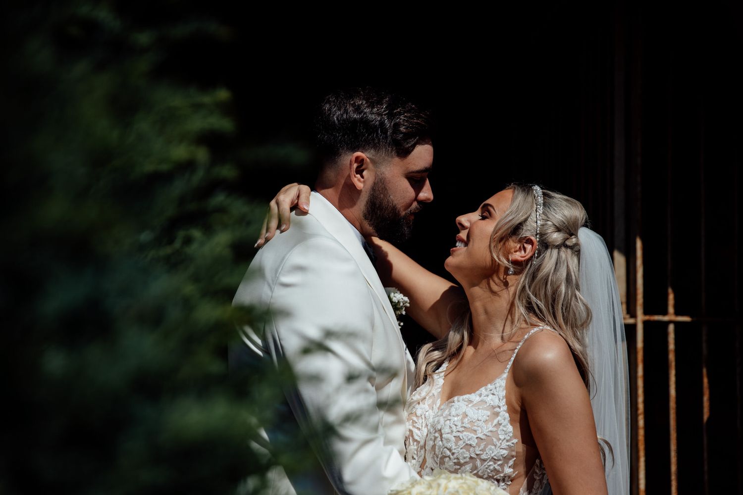 Romantic evening wedding portraits captured in soft natural lighting.