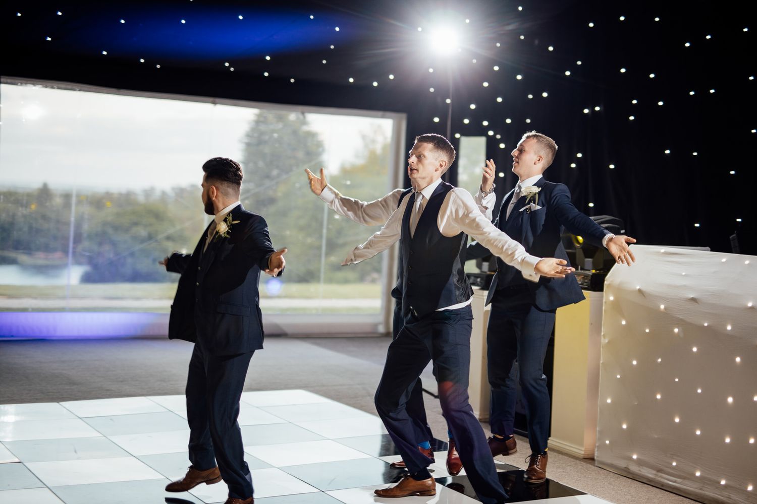 Nighttime wedding photos with starry backdrop and dramatic lighting.