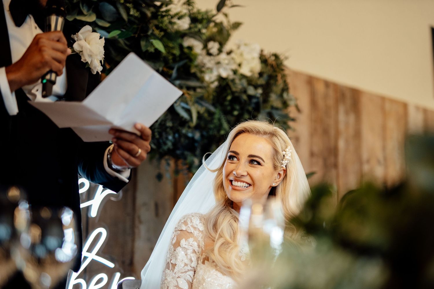 Candid wedding moments captured during an outdoor summer celebration.