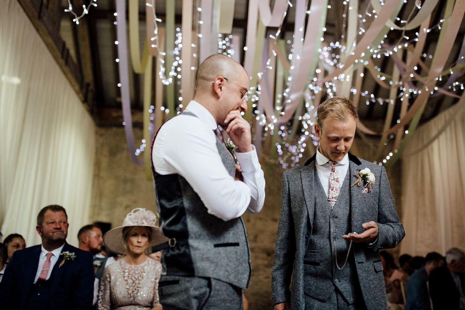Wedding reception venue decorated with twinkling string lights and festive atmosphere.
