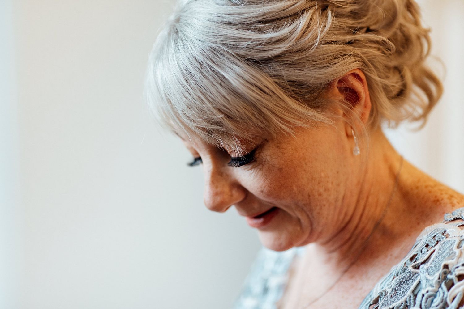 Close-up details of wedding day preparations with soft natural lighting.
