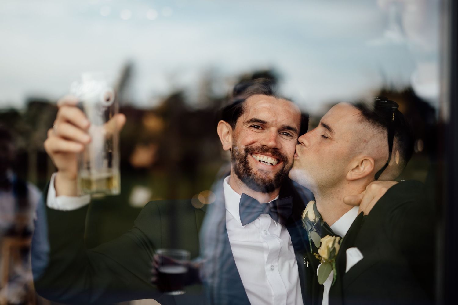 Candid moments of a wedding couple sharing laughter and embraces during their special day.