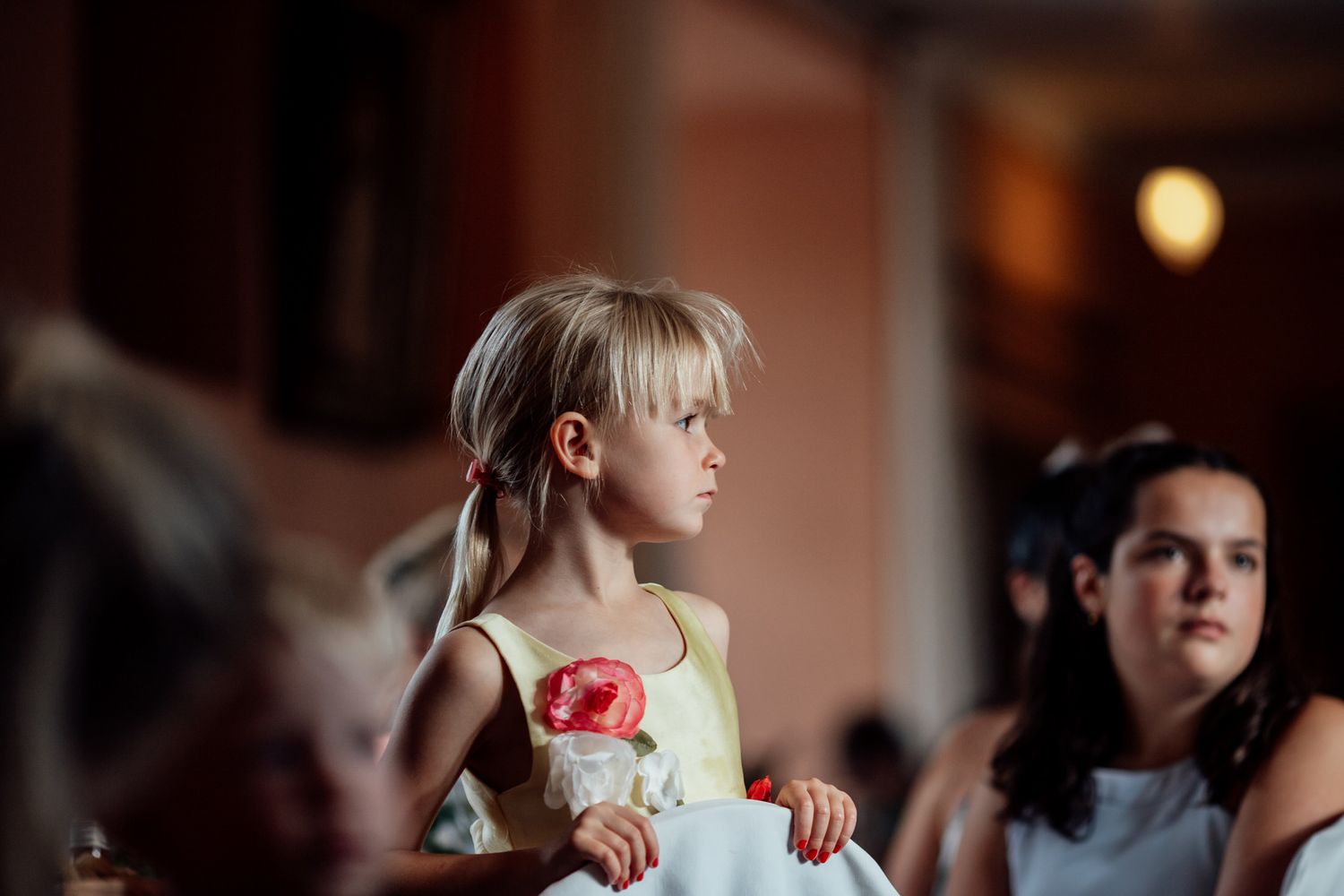 Warm-toned indoor scene with preparations and styling taking place.