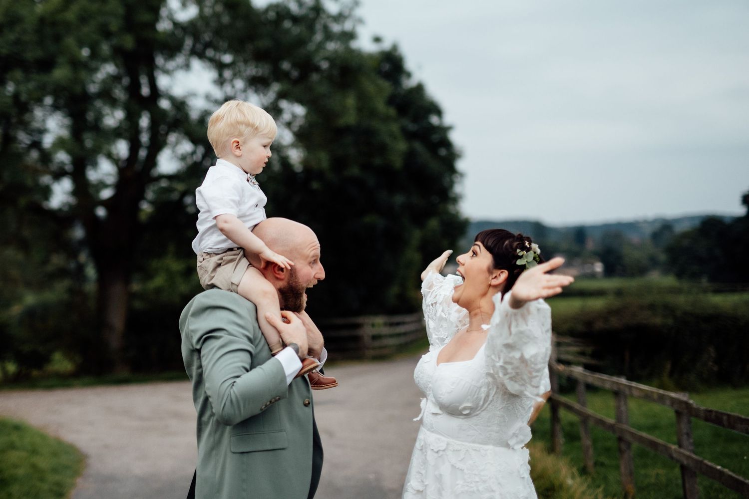 Wedding couple sharing intimate moments in a garden setting.