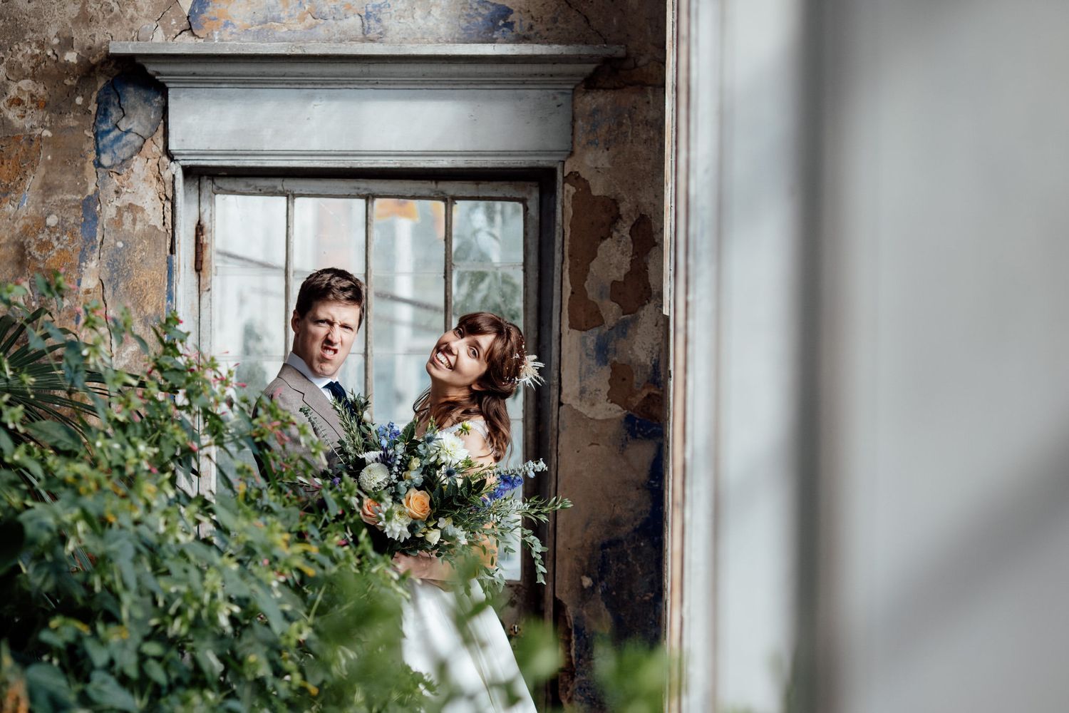 Wedding venue features rustic exposed brick walls and large window frames.