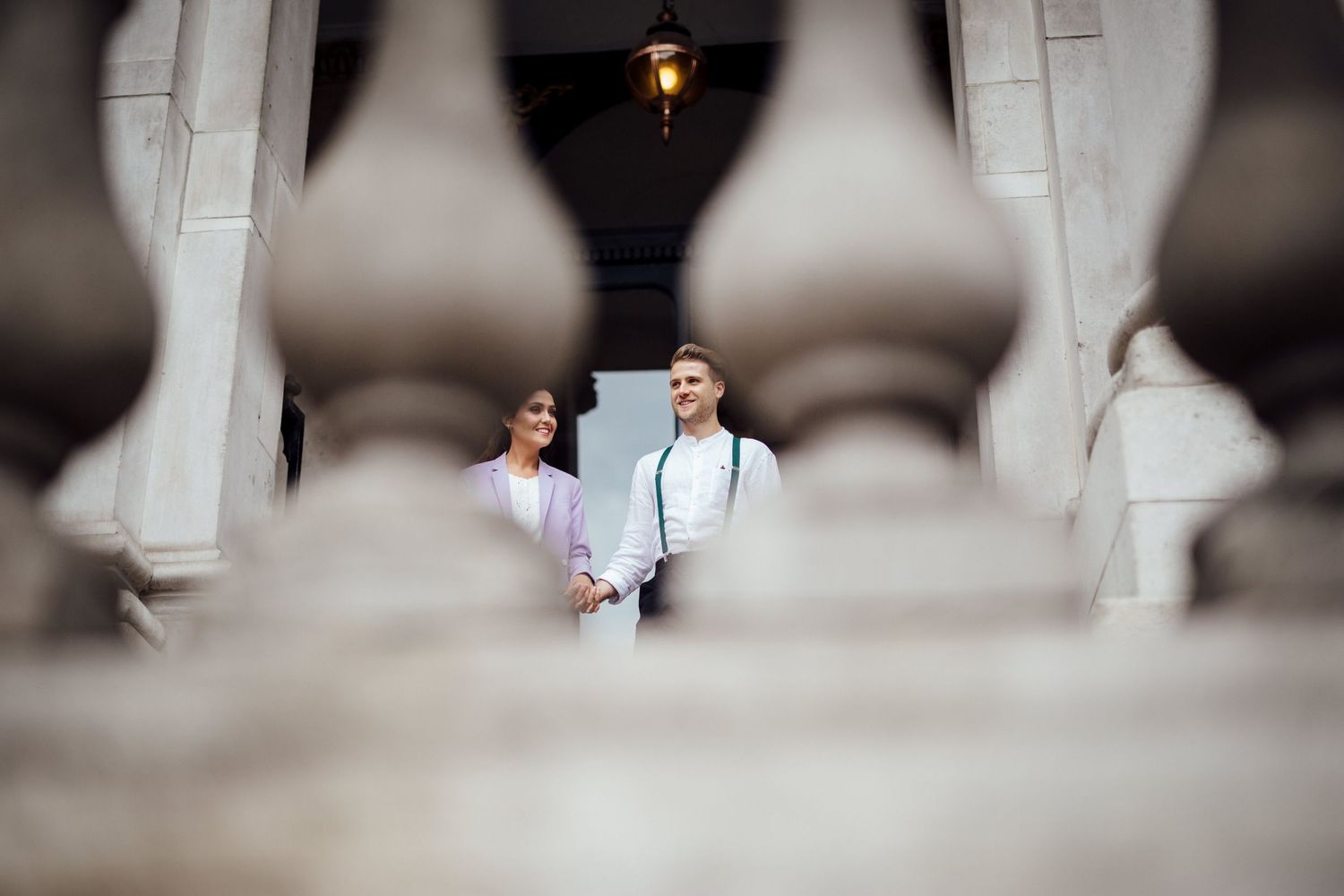 Artistic framed shot through architectural elements creating romantic atmosphere.