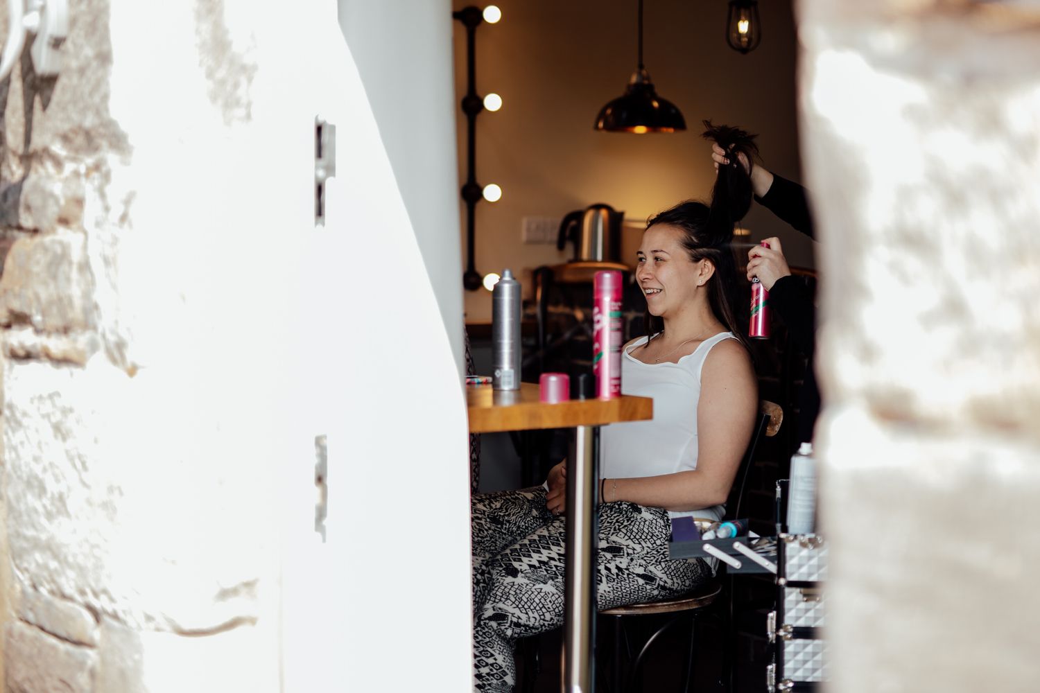 An intimate indoor scene with soft lighting through arched windows.