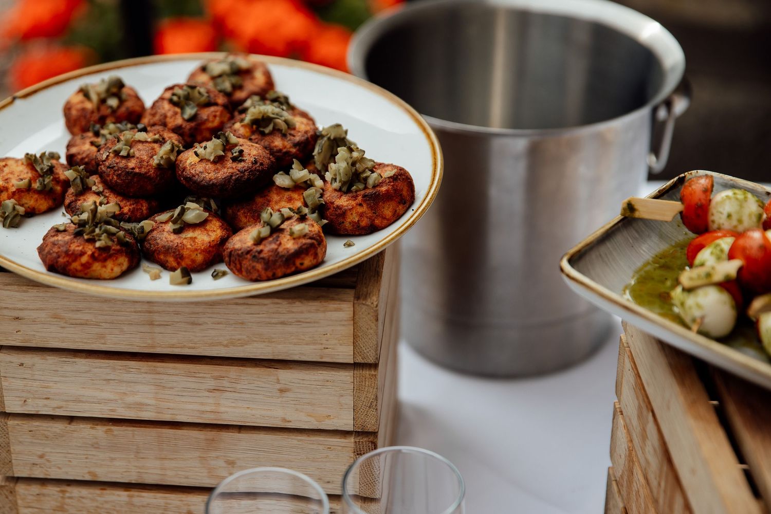 Gourmet appetizers and hors d'oeuvres displayed on wooden serving platters.